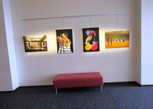 All four of Leah Odero's paintings grouped together at the art exhibit