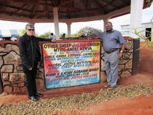 Kenya's Rev Michael Kimindu (right) with MCC Church Elder Rev Pat Bumgardner in front of the new ministry facility in Mtito Andei.