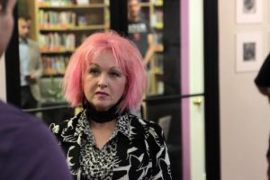 Cyndi Lauper visiting Raleigh's LGBT Center before her June 4th concert.  I recognize the bookshelves in the background!  (Photo courtesy of the Raleigh News and Observer)