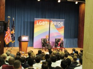 US Senator Tammy Baldwin and US Labor Secretary Thomas Perez on the stage at the US Department of Labor's 2016 LGBT Pride Event.