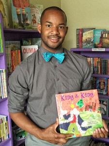 Mr. Omar Currie, holding the book he read to his third grade class, should be a leading candidate for NC Teacher of the Year! (photo washingtonpost.com)